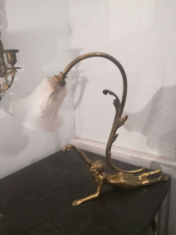 Gilded bronze lamp representing a reclining naked woman