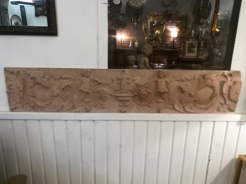 Large terracotta plaque depicting an antique frieze in relief