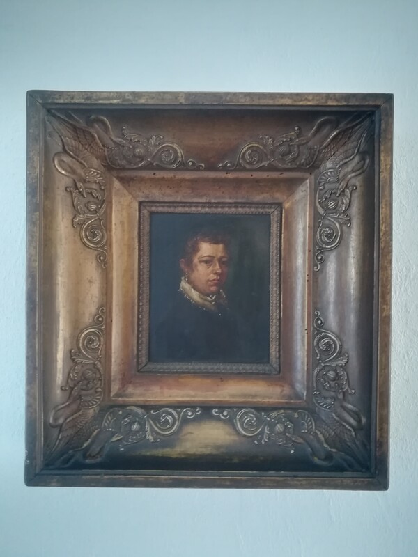 Oil on copper portrait of a woman in a gilded wood frame