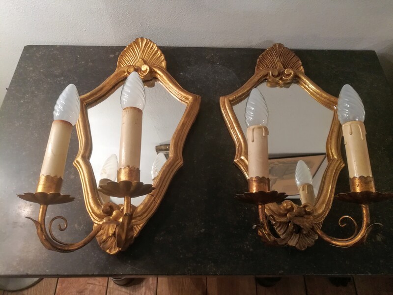 Pair of gilt metal wall lights in gilt wood mirrors