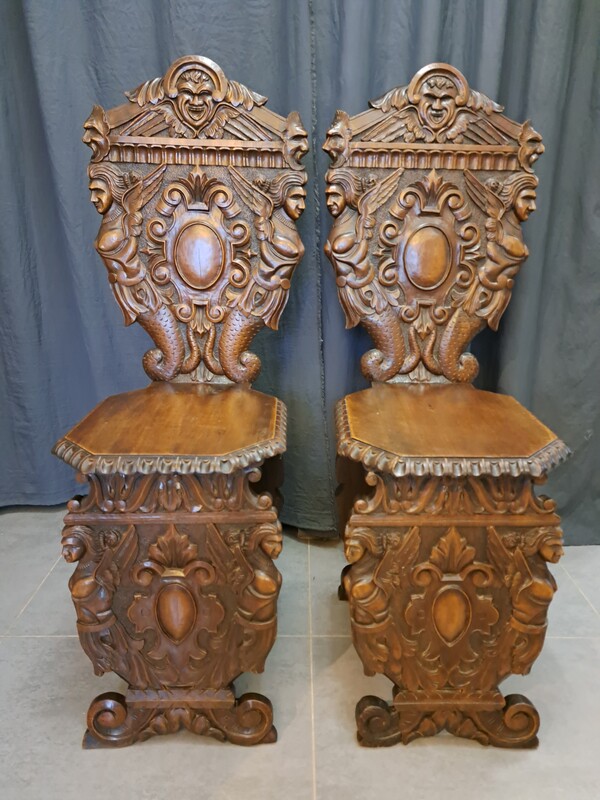 Pair of Italian Renaissance style carved walnut sgabelli