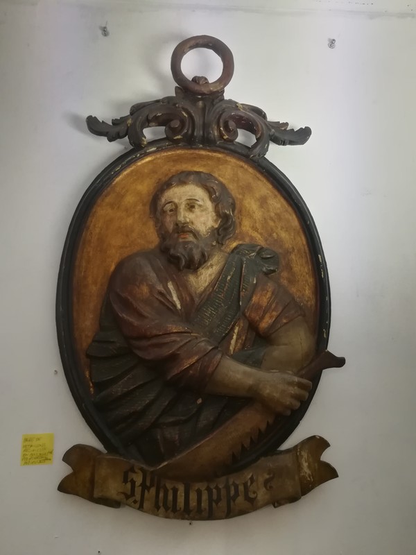 Pair of large polychrome carved wooden medallions