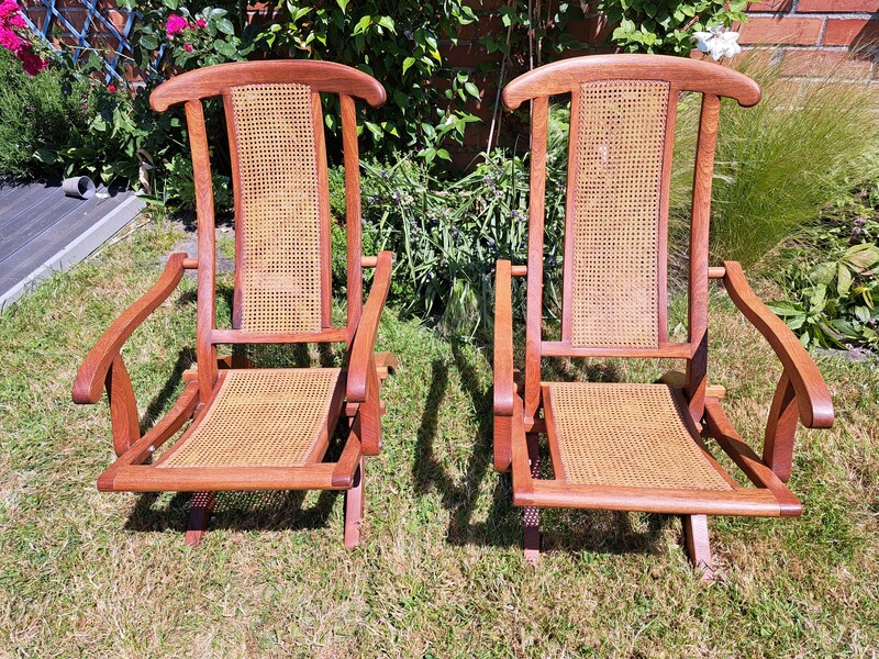 Pair of cane and teak deckchairs