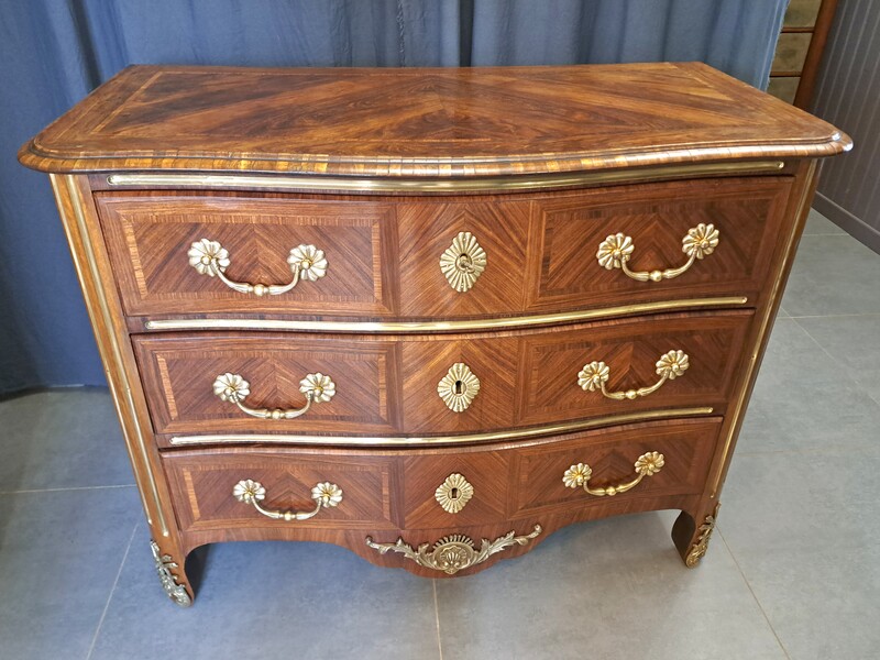 Regency style chest of drawers in rosewood and gilded bronze