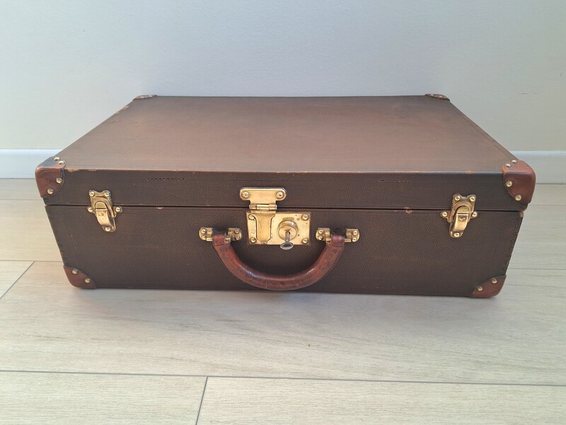 Louis Vuitton suitcase in Vuittonite, leather and golden brass